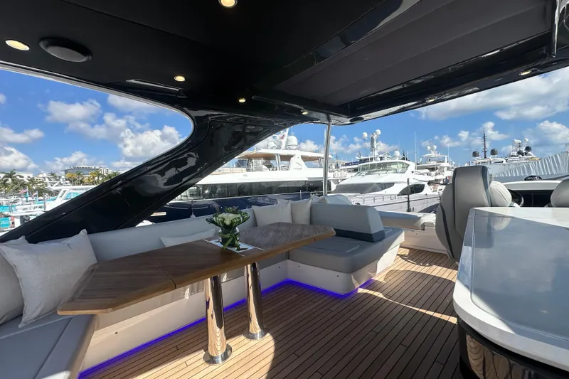 Slide: The Image of Luxurious 2026 Fairline Squadron 58 yacht interior with elegant seating and wooden table. - 48