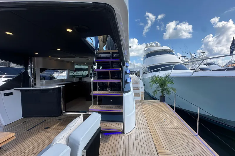 Slide: The Image of Luxurious 2026 Fairline Squadron 58 yacht docked, showcasing elegant interior and exterior design. - 13