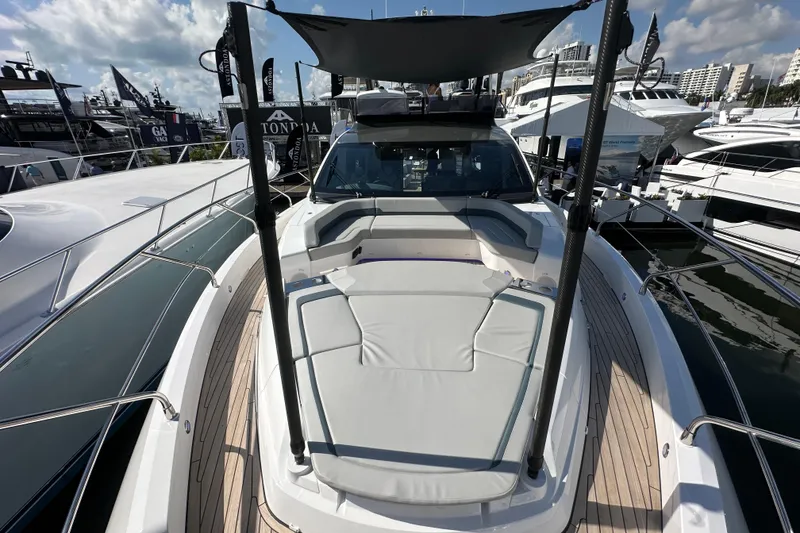 Slide: The Image of 2026 Fairline Squadron 58 yacht with sleek deck design and luxurious seating area. - 62