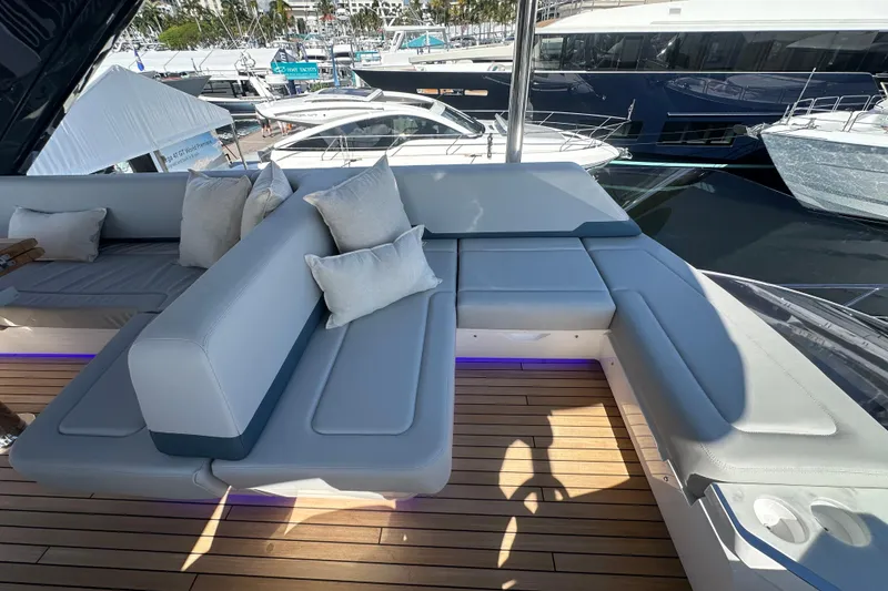Slide: The Image of Luxurious seating area on 2026 Fairline Squadron 58 yacht, featuring plush cushions and sleek design. - 57