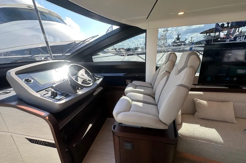 Slide: The Image of Interior of 2026 Fairline Squadron 58 yacht with modern helm and seating. - 22