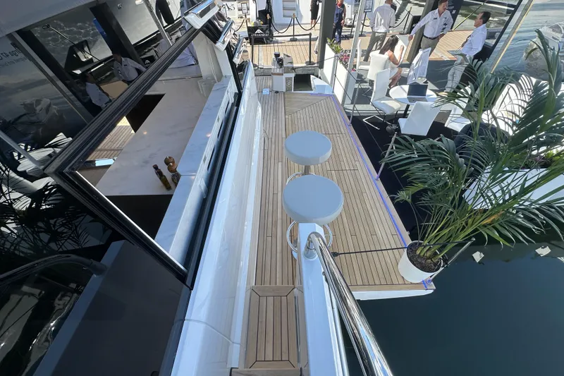Slide: The Image of Luxury yacht Fairline Squadron 58, 2026 model, featuring elegant deck and seating area. - 65