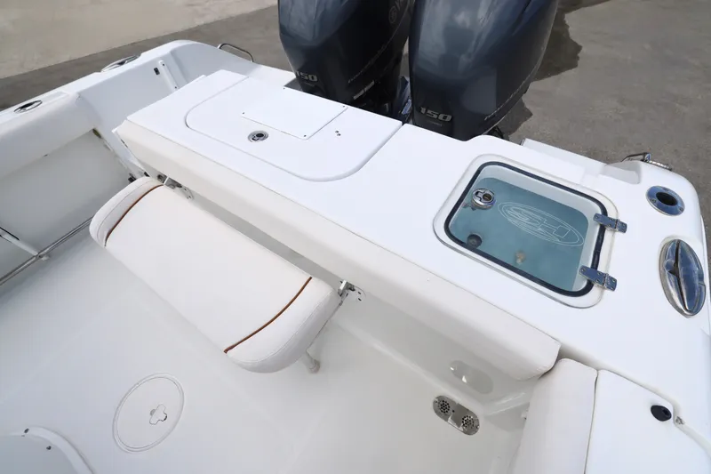 Slide: The Image of 2021 Sea Hunt Gamefish 25 boat interior with seating and storage compartments. - 13