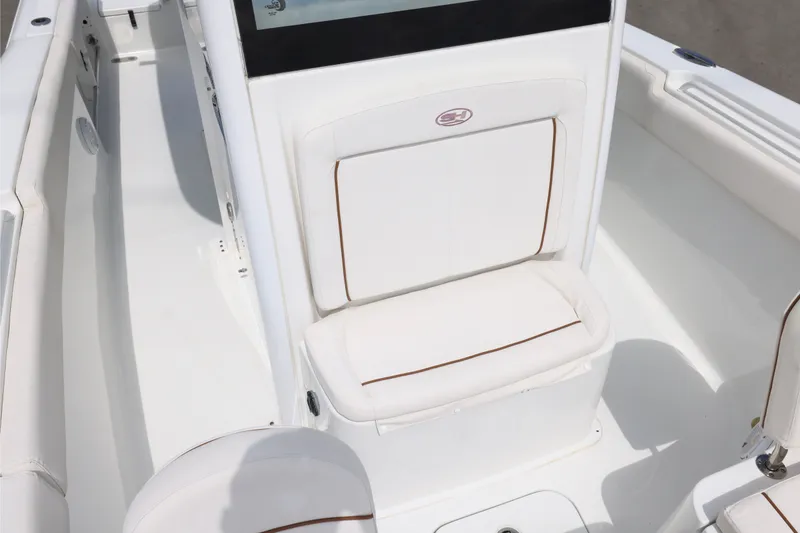Slide: The Image of 2021 Sea Hunt Gamefish 25 boat interior with white seating and sleek design. - 18