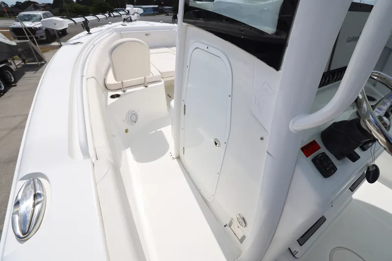 Slide: The Image of 2021 Sea Hunt Gamefish 25 boat interior with steering console and seating area. - 17