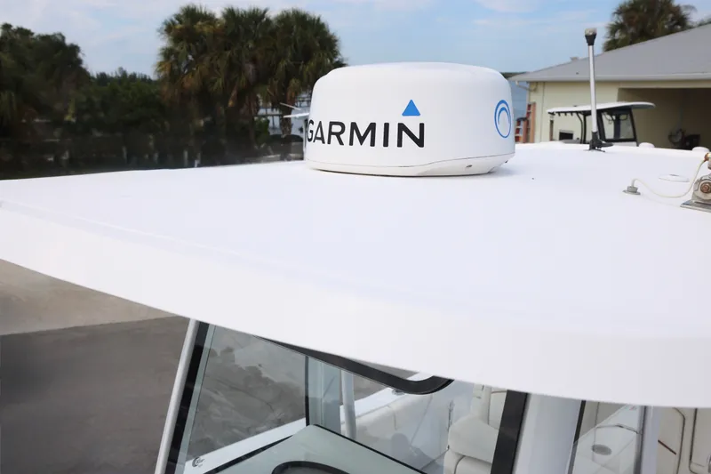 Slide: The Image of 2021 Sea Hunt Gamefish 25 boat with Garmin radar on the roof. - 16