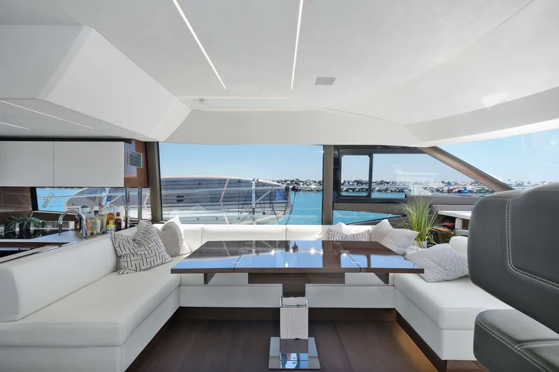 Slide: The Image of Luxurious interior of 2022 Prestige 590 yacht with elegant seating and ocean view. - 37