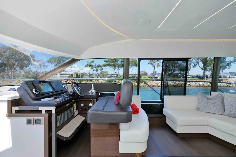 Slide: The Image of Luxurious interior of 2022 Prestige 590 yacht with modern helm and comfortable seating. - 41