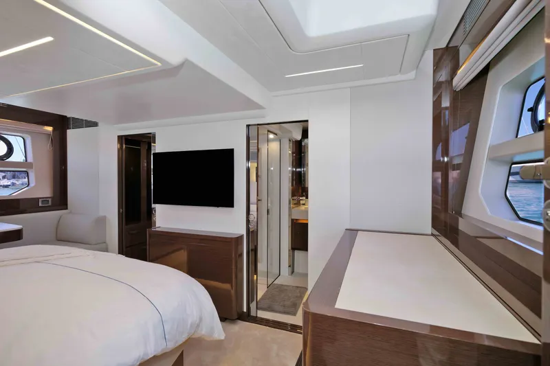 Slide: The Image of Luxurious interior of 2022 Prestige 590 yacht with modern bedroom and sleek design. - 53