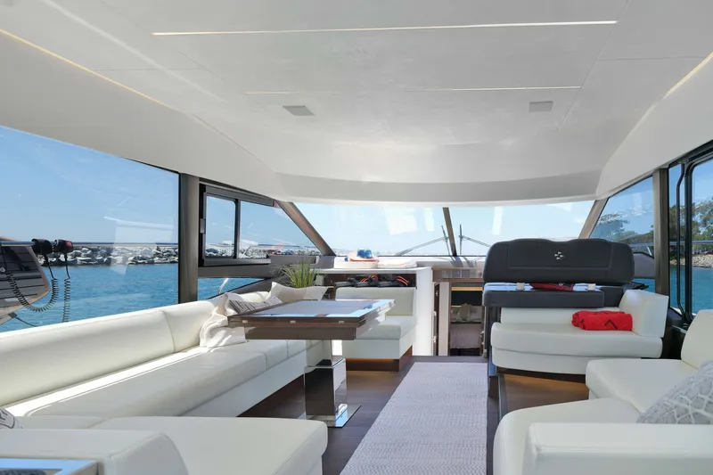Slide: The Image of Luxurious interior of a 2022 Prestige 590 yacht with panoramic ocean views. - 35