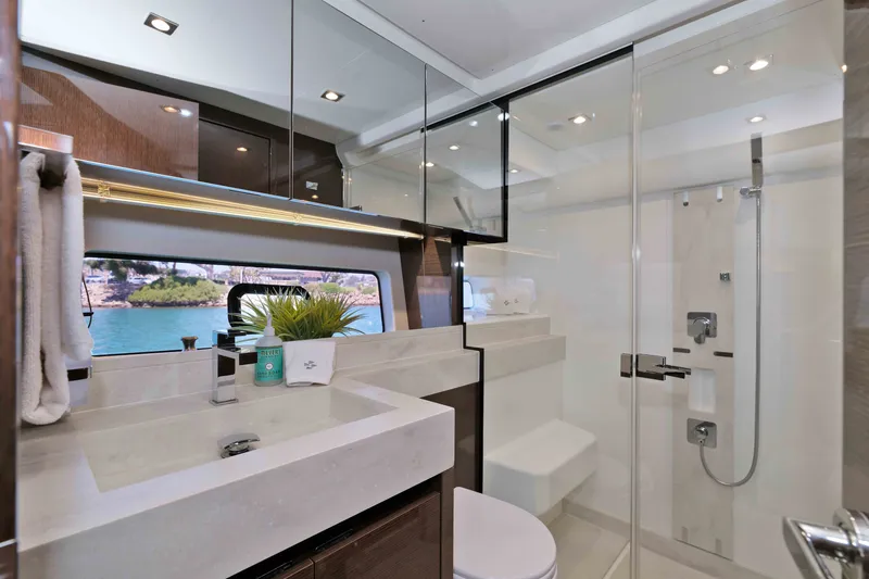 Slide: The Image of Luxurious bathroom interior of 2022 Prestige 590 yacht with modern fixtures and ocean view. - 48
