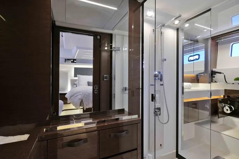 Slide: The Image of Luxurious interior of 2022 Prestige 590 yacht featuring modern bathroom and cozy bedroom. - 56