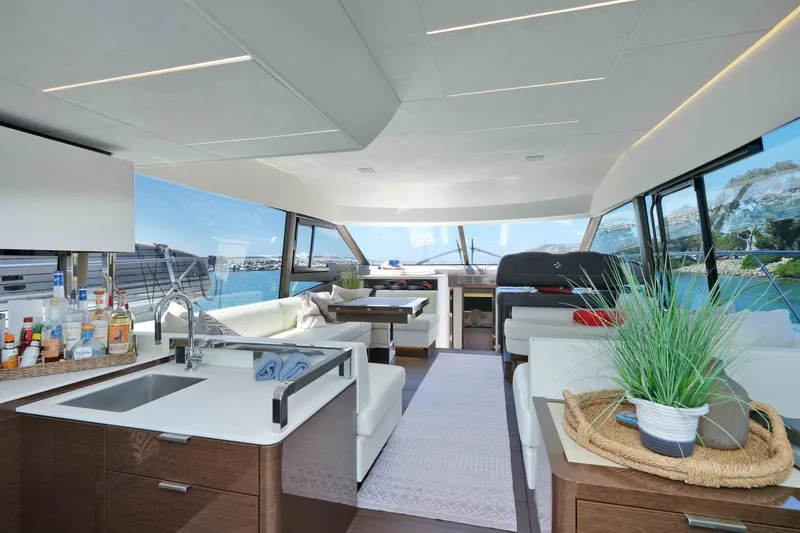 Slide: The Image of Luxurious interior of 2022 Prestige 590 yacht with modern kitchen and scenic ocean views. - 33