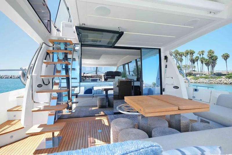 Slide: The Image of Luxurious 2022 Prestige 590 yacht interior with elegant seating and modern design. - 26