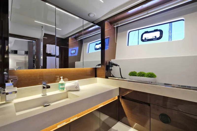 Slide: The Image of Luxurious bathroom interior of 2022 Prestige 590 yacht with modern fixtures and elegant design. - 58