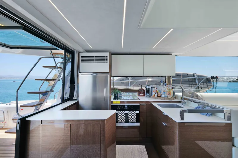 Slide: The Image of Luxurious kitchen interior on a 2022 Prestige 590 yacht with ocean view. - 32