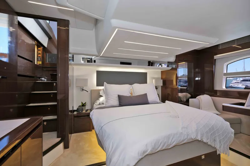 Slide: The Image of Luxurious bedroom interior of 2022 Prestige 590 yacht with modern design and elegant furnishings. - 50