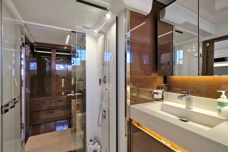 Slide: The Image of Luxurious bathroom interior of 2022 Prestige 590 yacht with modern fixtures and elegant design. - 59