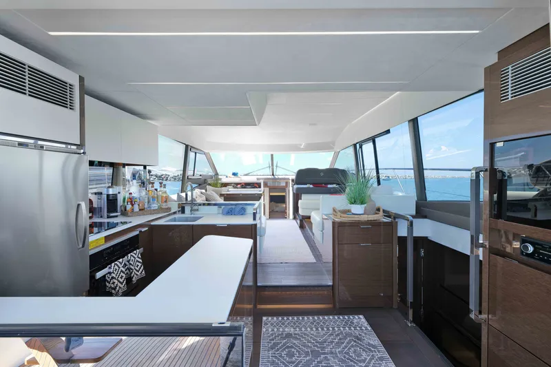Slide: The Image of Luxurious interior of 2022 Prestige 590 yacht with modern kitchen and panoramic windows. - 31