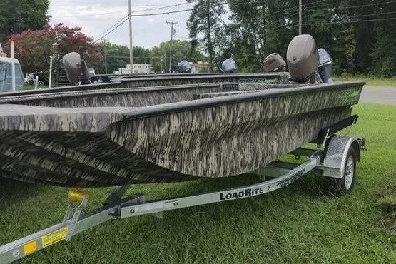 Slide: The Image of 2027 Havoc 1656 MRST MACH 1 boat on Load Rite trailer, parked on grass. - 11