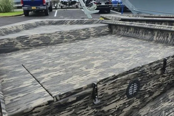 Slide: The Image of 2027 Havoc 1656 MRST MACH 1 boat with camouflage pattern in a parking lot. - 4