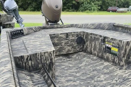 Slide: The Image of 2027 Havoc 1656 MRST MACH 1 boat interior with camouflage design and motor. - 3