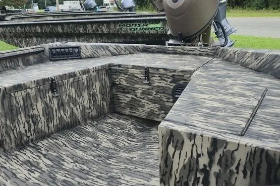 Slide: The Image of 2027 Havoc 1656 MRST MACH 1 boat interior with camouflage design and modern controls. - 5