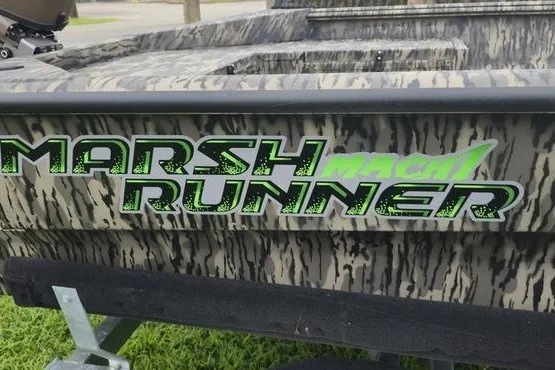 Slide: The Image of 2027 Havoc 1656 MRST MACH 1 boat with "Marsh Runner" decal on camouflage exterior. - 10
