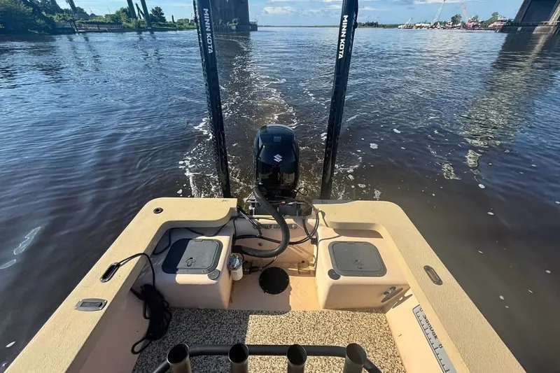 Slide: The Image of 2024 Jones Brothers Bateau 20 boat on water, featuring Minn Kota trolling motor. - 4