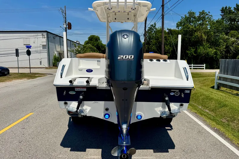 Slide: The Image of 2017 Sea Hunt Ultra 225 boat with Yamaha 200 engine on a sunny street. - 3
