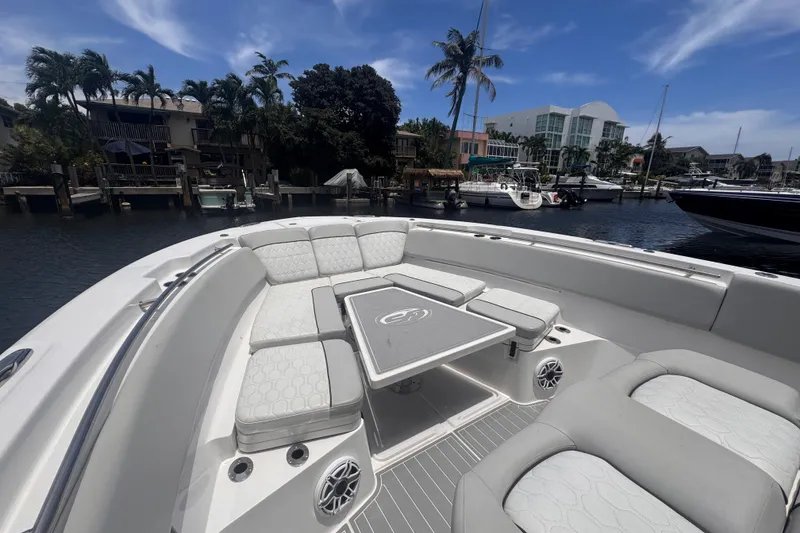 Slide: The Image of Luxurious seating area on 2023 Sea Fox 368 Commander boat, docked in a scenic marina. - 4