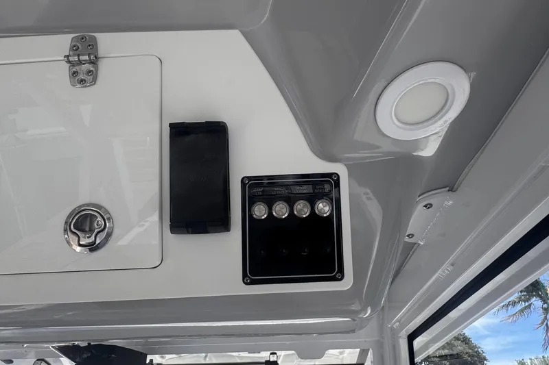 Slide: The Image of 2023 Sea Fox 368 Commander boat interior with control panel and hatch. - 9