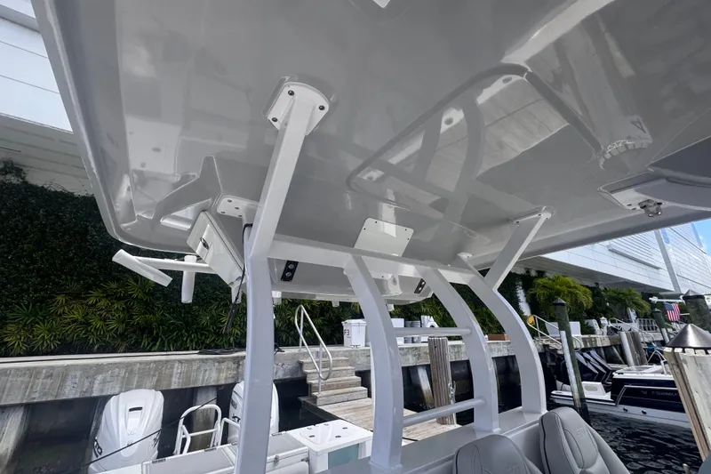 Slide: The Image of 2023 Sea Fox 368 Commander boat with sleek design and modern features at a marina. - 19