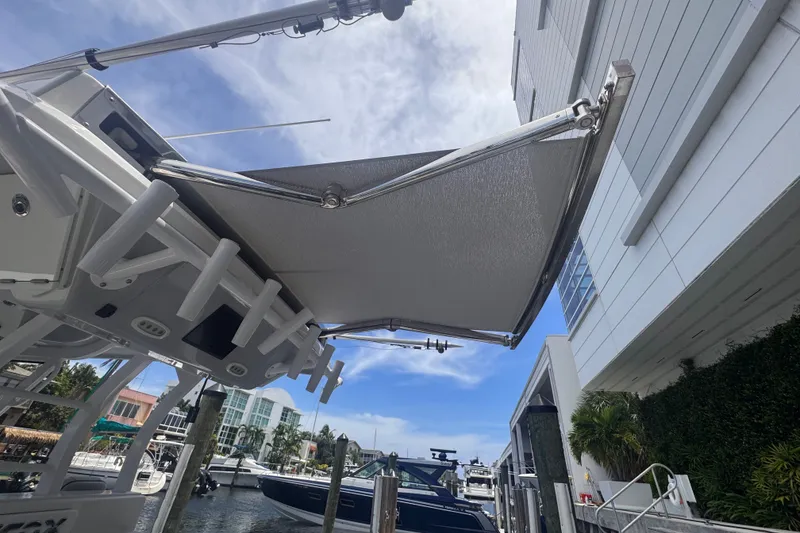 Slide: The Image of 2023 Sea Fox 368 Commander boat with extended canopy at marina dock. - 35