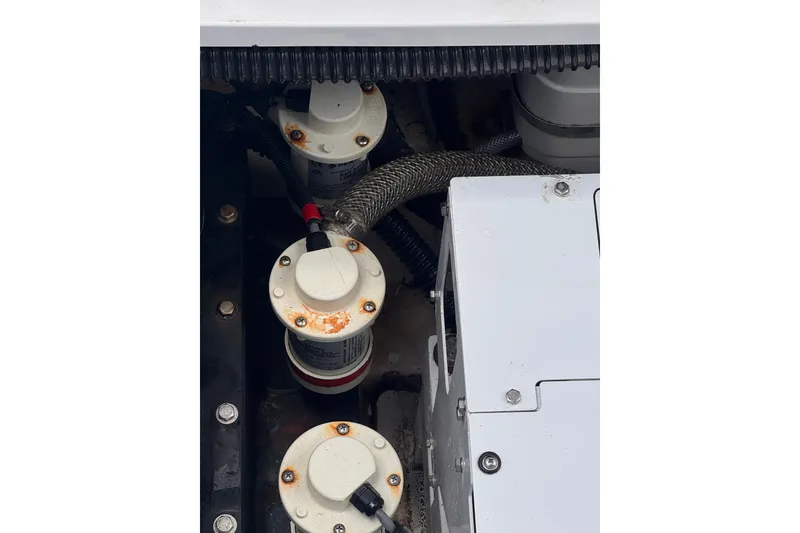 Slide: The Image of Engine compartment of 2023 Sea Fox 368 Commander with visible filters and components. - 51