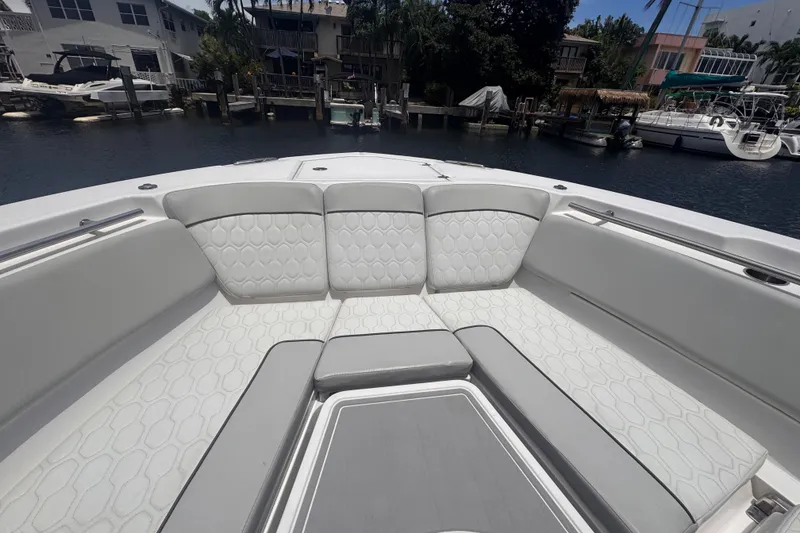 Slide: The Image of Luxurious seating on 2023 Sea Fox 368 Commander boat, docked in a serene marina. - 5