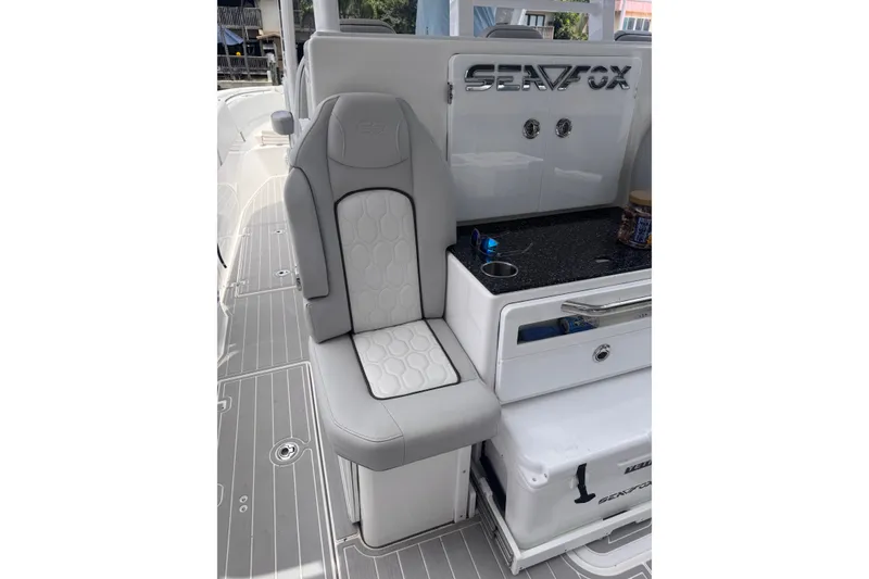 Slide: The Image of 2023 Sea Fox 368 Commander boat interior with sleek seating and storage features. - 32