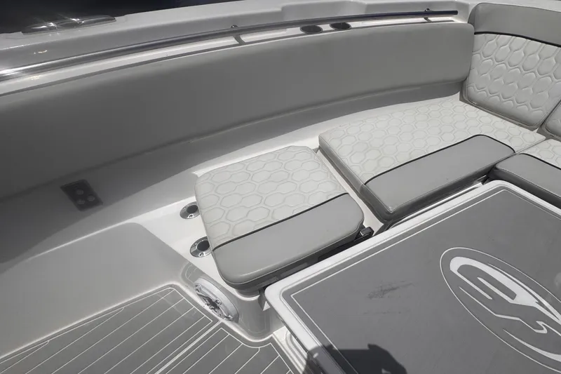 Slide: The Image of 2023 Sea Fox 368 Commander boat interior with cushioned seating and sleek design. - 26