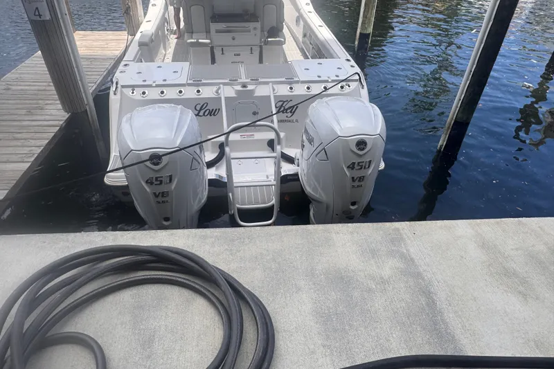 Slide: The Image of 2023 Sea Fox 368 Commander with twin 450 V8 engines docked at marina. - 59