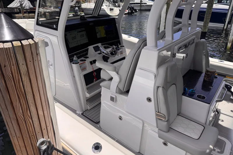 Slide: The Image of 2023 Sea Fox 368 Commander boat interior with helm and seating area. - 57