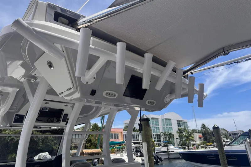 Slide: The Image of 2023 Sea Fox 368 Commander boat interior with rod holders and electronic equipment. - 34