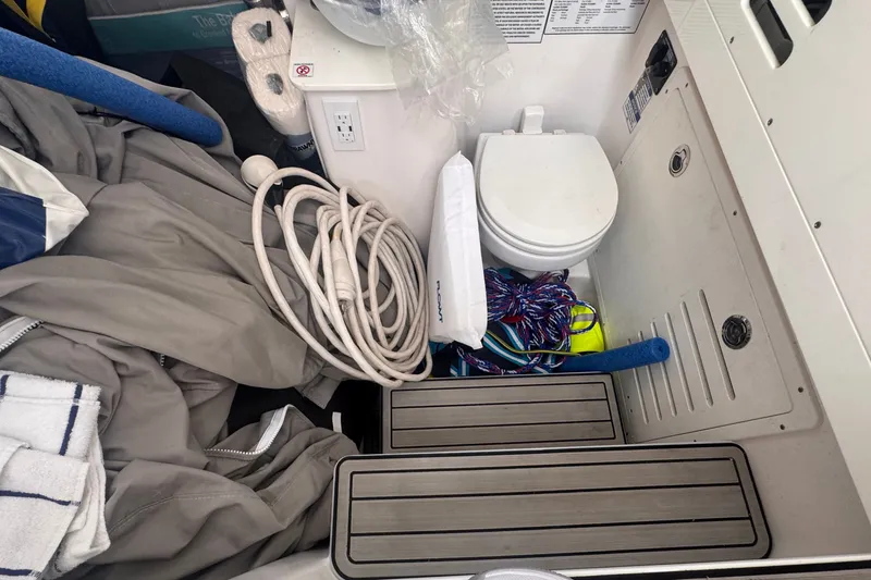 Slide: The Image of Interior of 2023 Sea Fox 368 Commander boat with toilet and storage items. - 23