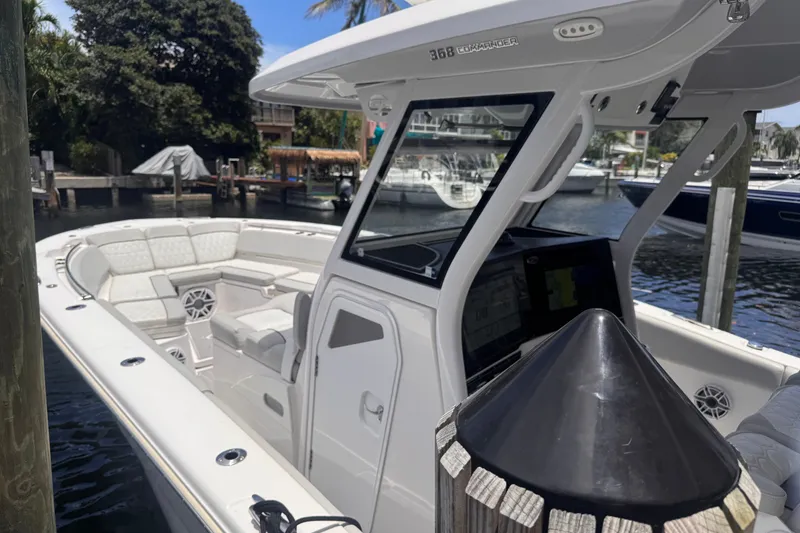 Slide: The Image of 2023 Sea Fox 368 Commander boat docked, featuring spacious seating and modern design. - 56