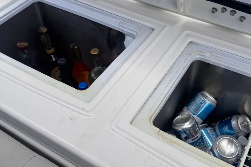 Slide: The Image of Built-in coolers on 2023 Sea Fox 368 Commander, stocked with beverages and ice. - 29