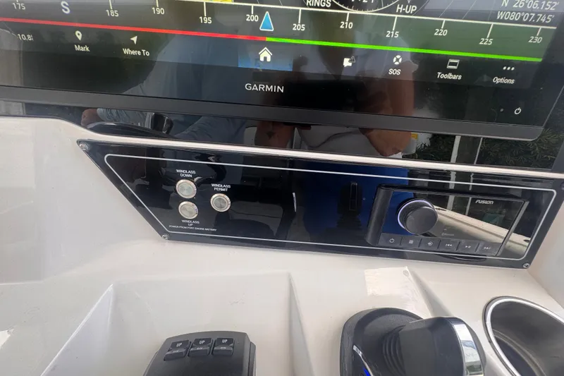 Slide: The Image of Control panel of 2023 Sea Fox 368 Commander with Garmin display and Fusion audio system. - 13