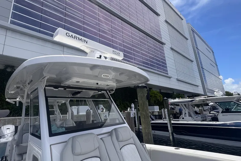 Slide: The Image of 2023 Sea Fox 368 Commander boat docked near modern building. - 41