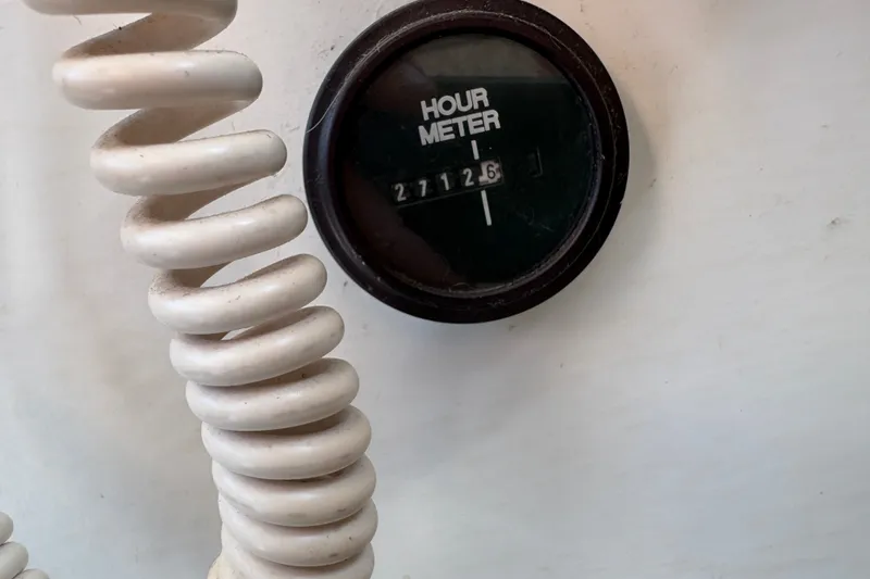 Slide: The Image of Hour meter reading 2712.6 on 1978 Mainship 34 Trawler boat dashboard. - 17