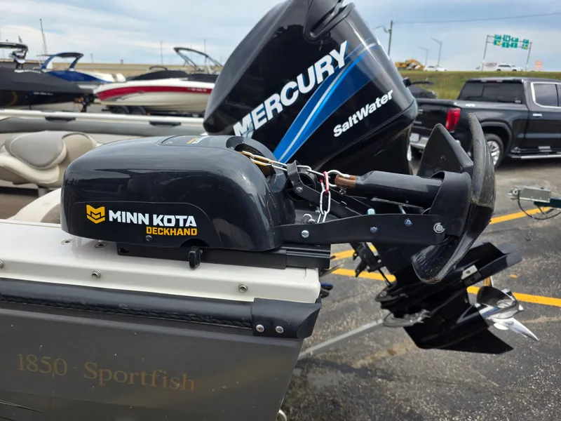 Slide: The Image of A 2004 Crestliner 1850 Sportfish with a Minn Kota Deckhand and a Mercury outboard motor. - 13
