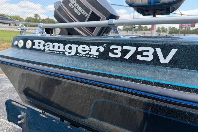 Slide: The Image of 1989 Ranger 373V boat with Johnson GT150 motor, close-up view. - 6
