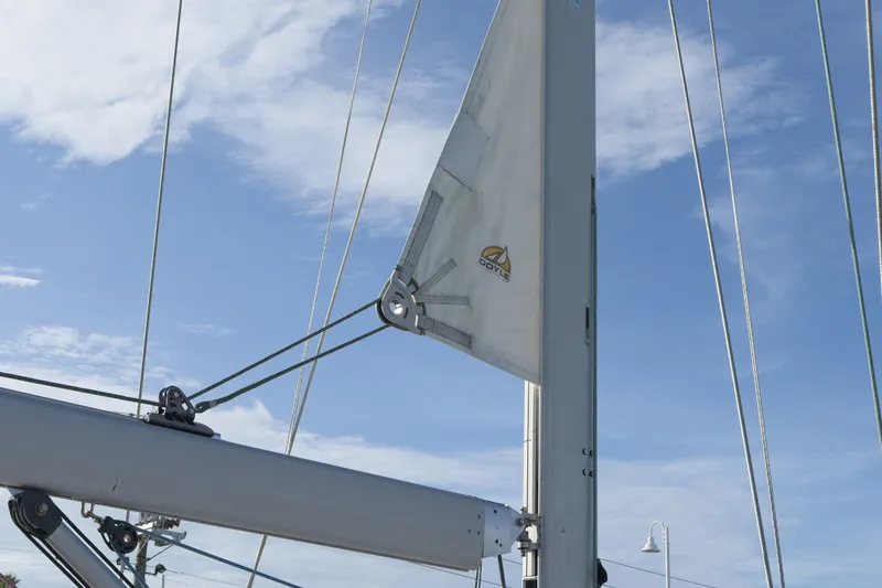 Slide: The Image of Sail of 2011 Jeanneau Sun Odyssey 50 DS against a clear blue sky. - 16